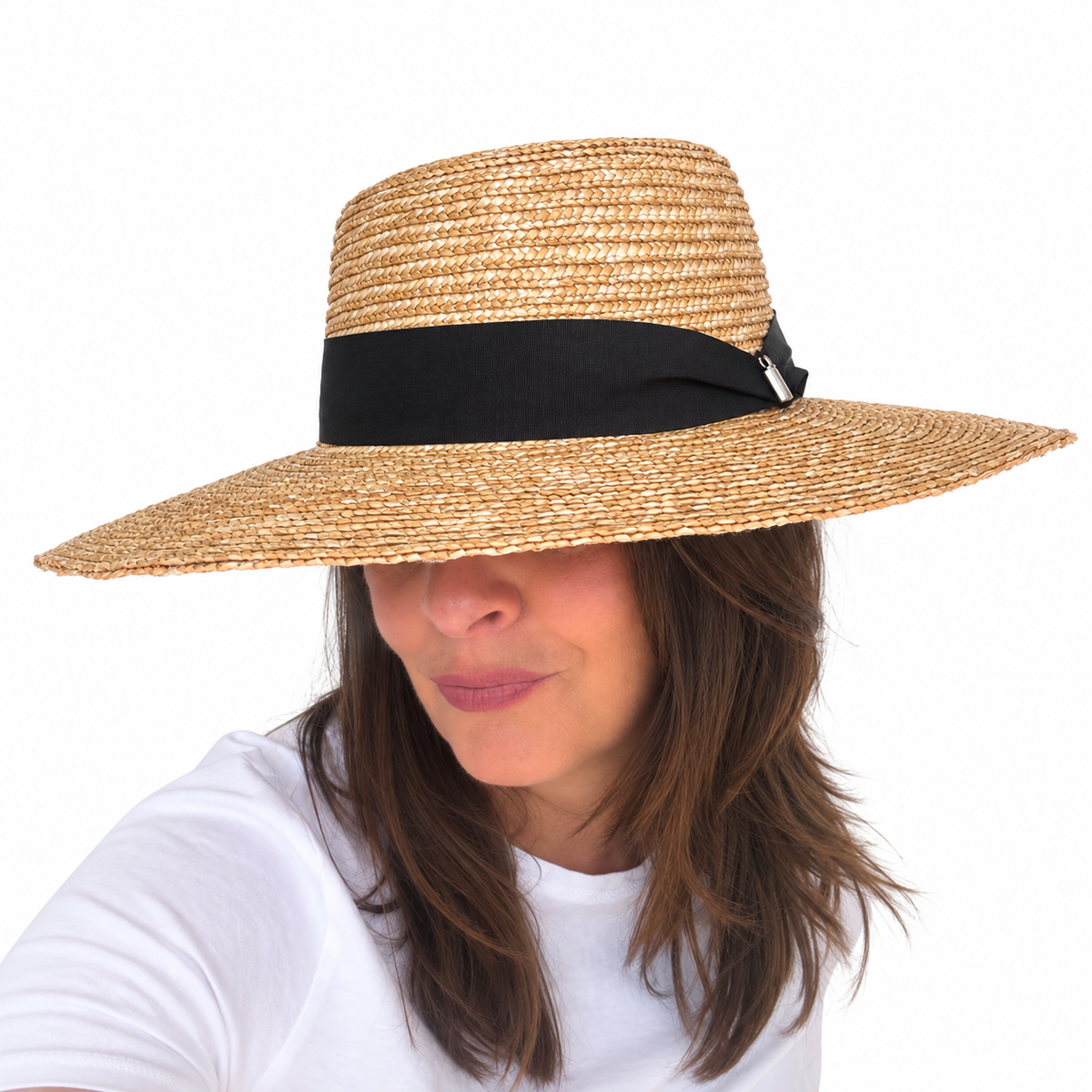 Got you covered Natural woven straw sun hat with wide brim and black band worn by brunette woman