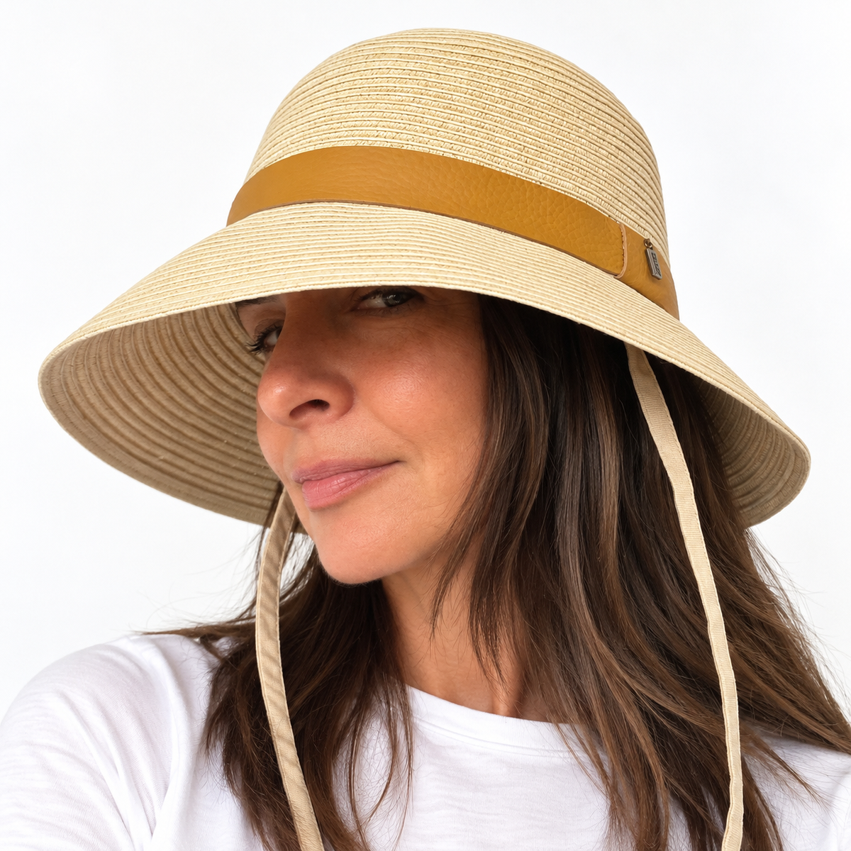 Angled view of the Just Cruising Naturally sun hat, highlighting its relaxed brim and tonal leather trim.