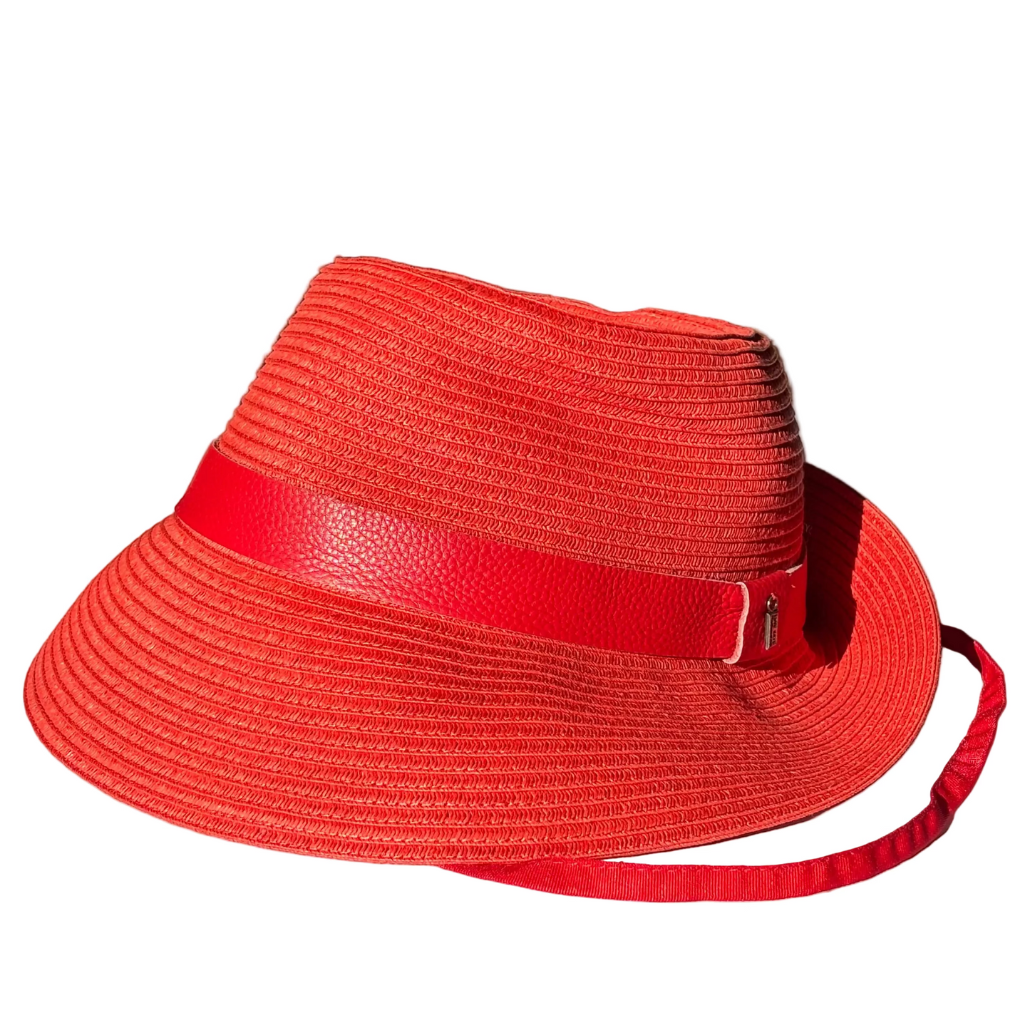 Side view of the Just Cruising So Racy red sun hat showing its paper ribbon weave, shaped brim and leather band.