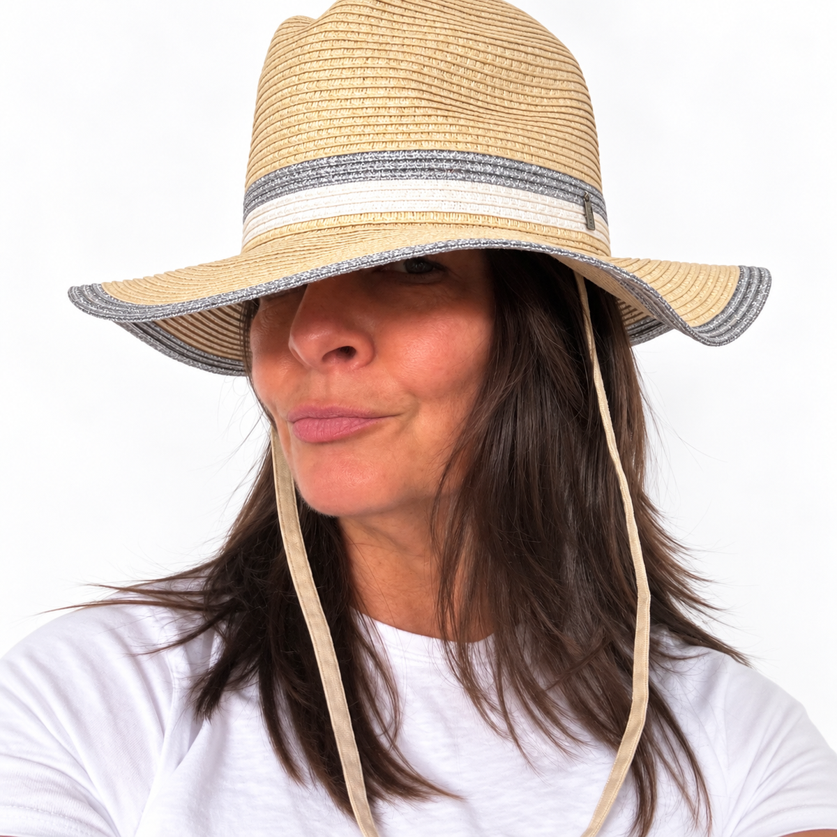 Silver Lining metallic paper ribbon sun hat worn with its wide brim down.