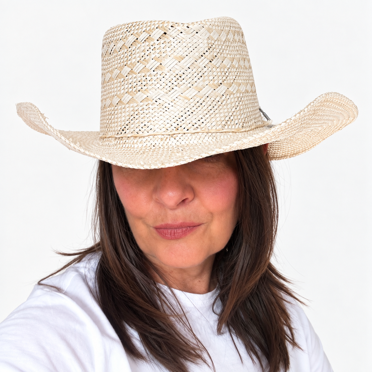 Sun-Kissed Creama woven straw hat with wide brim worn by brunette woman
