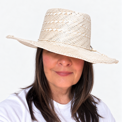 Sun-Kissed Creama woven straw sun hat shown from side angle on brunette woman