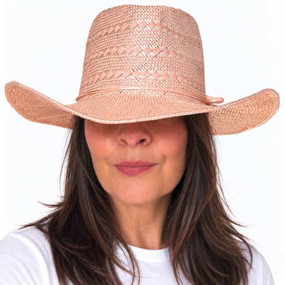 SUN-KISSED Blush wide brim straw hat with pearl embellishment worn by brunette woman