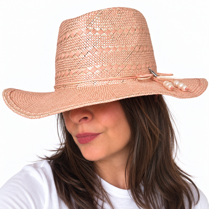SUN-KISSED Blush woven straw sun hat shown from side angle on brunette woman