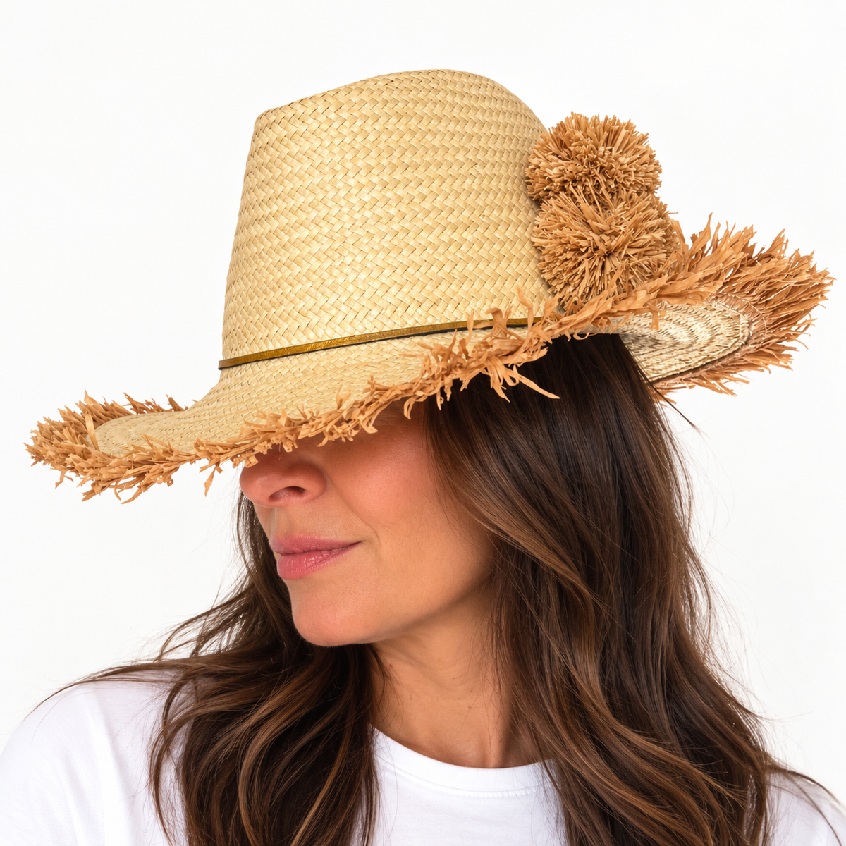 Brunette model in Happy on the Fringe Handwoven hat with pom poms