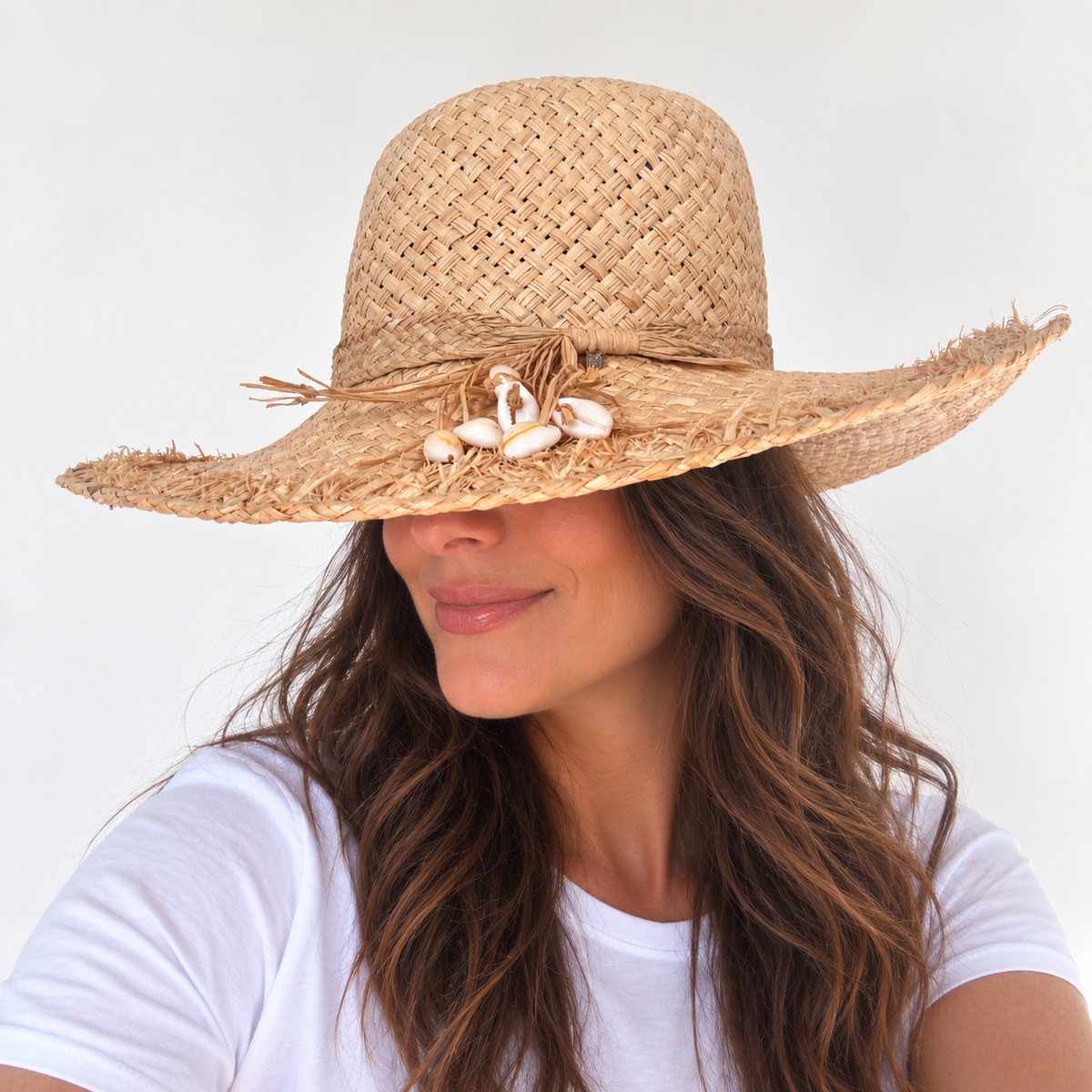 Shell We Dance? natural raffia hat with shell trim worn by woman