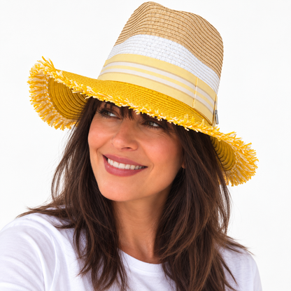 Woman wearing Here Comes the Sun with Bangs yellow and natural paper hat, smiling
