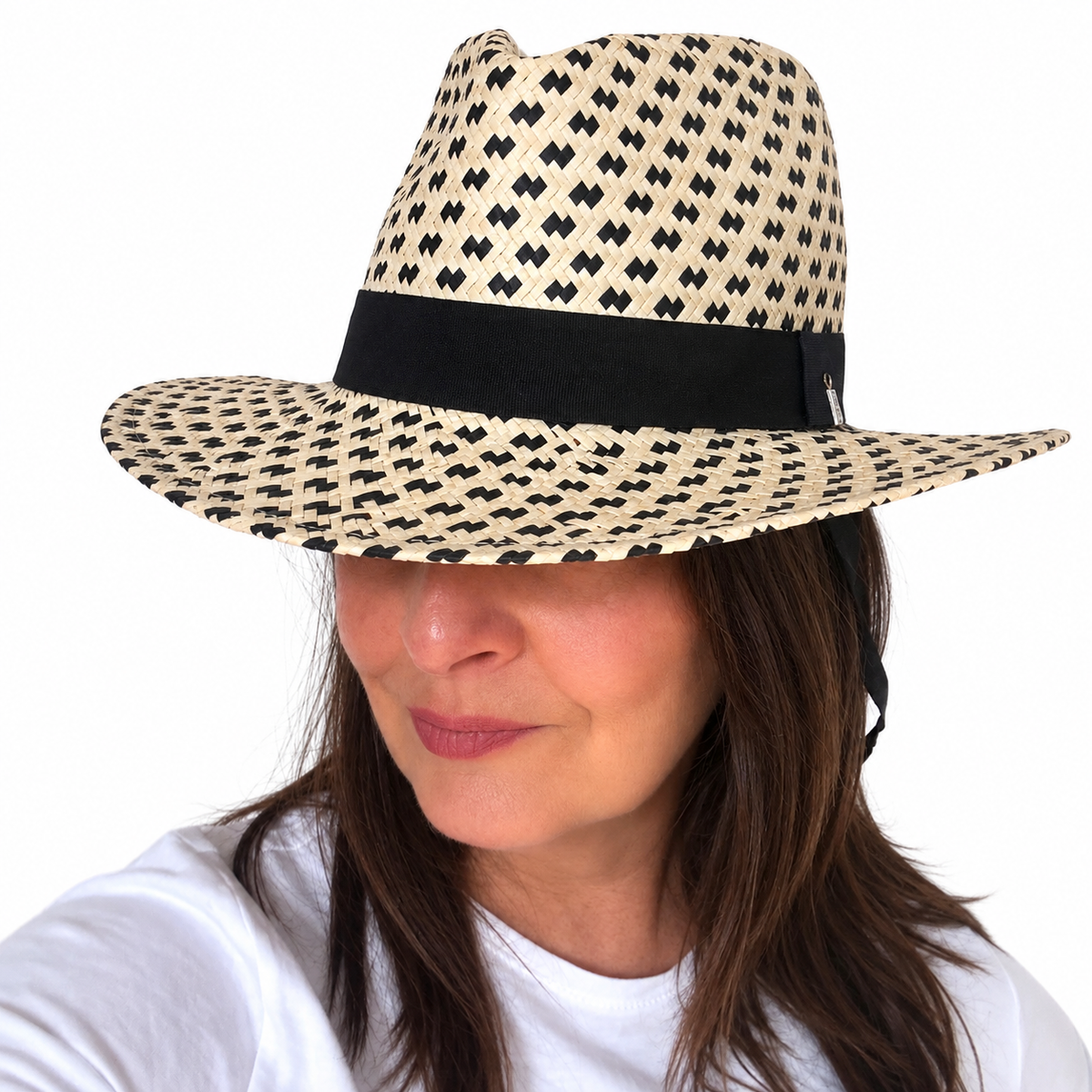 Salt and Pepper patterned woven hat with black band worn by brunette woman, white background