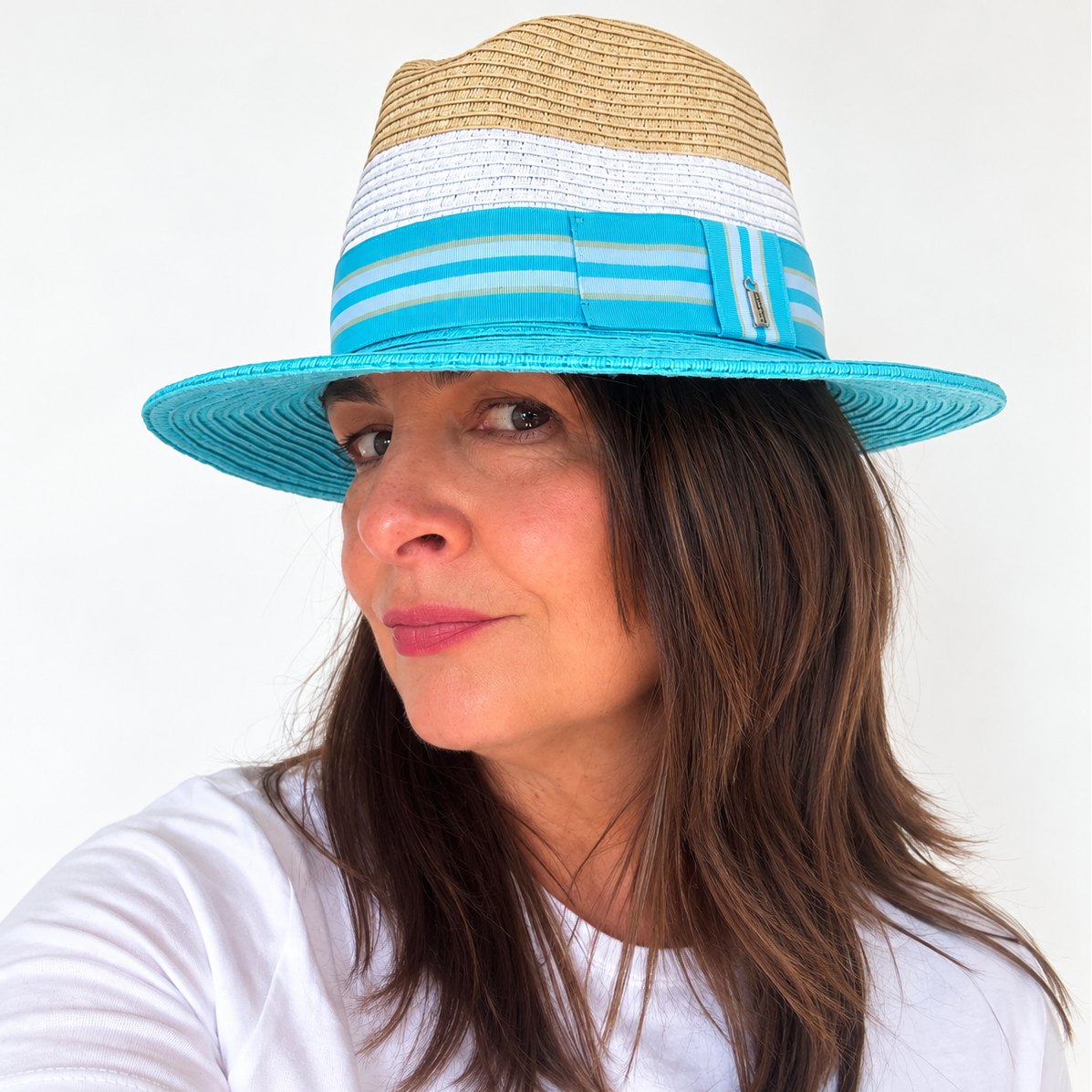 Woman wearing Dive Right In blue and natural sun hat, side view
