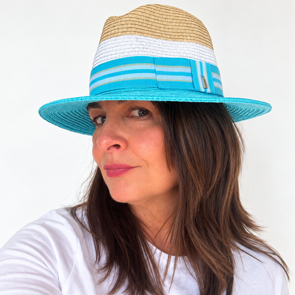 Woman wearing Dive Right In blue and natural sun hat, side view

