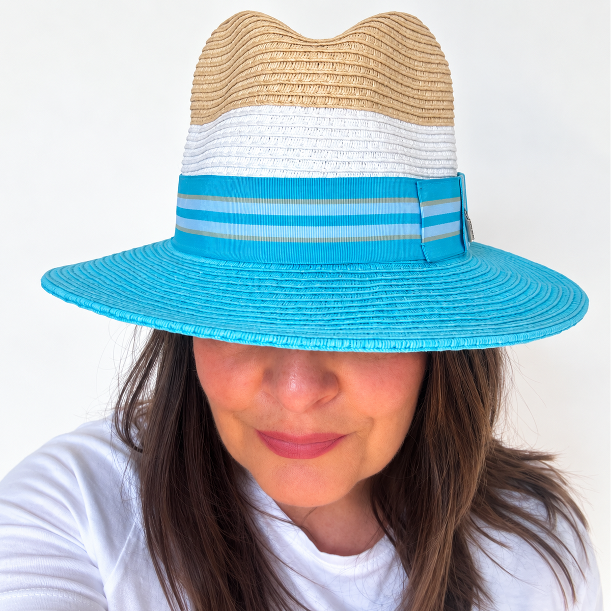 Woman wearing Dive Right In blue and natural sun hat, front view
