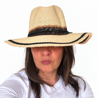 As I Am natural handwoven paper hat with black trim worn by woman, front view
