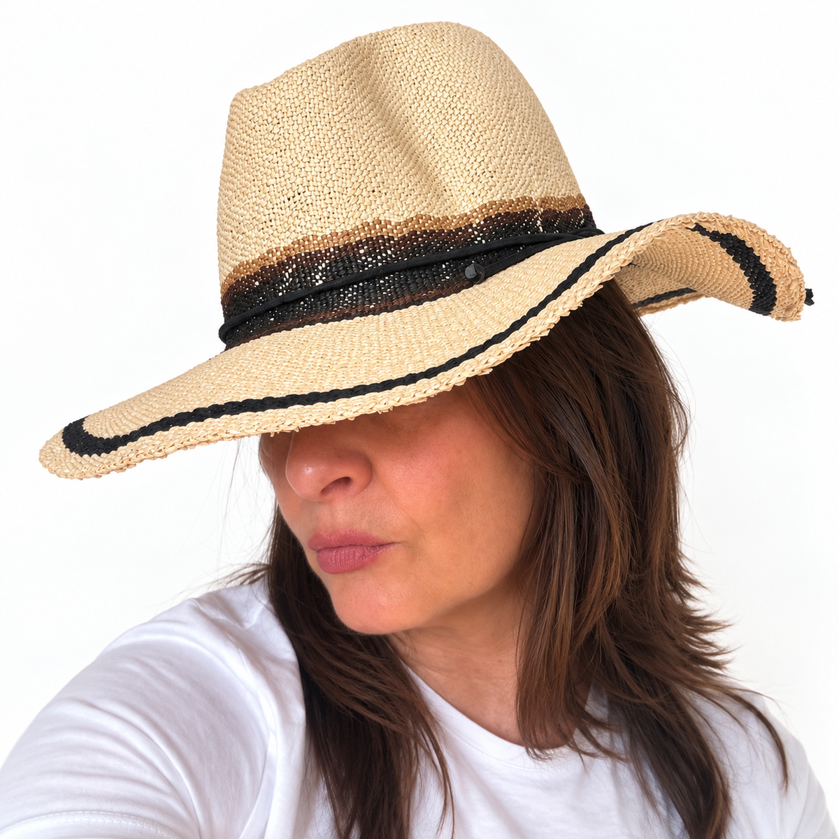 As I Am natural handwoven paper hat with black trim worn by woman, side view