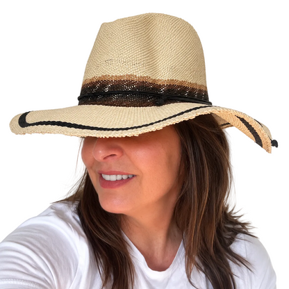As I Am natural handwoven paper hat with black trim worn by woman, side view smiling
