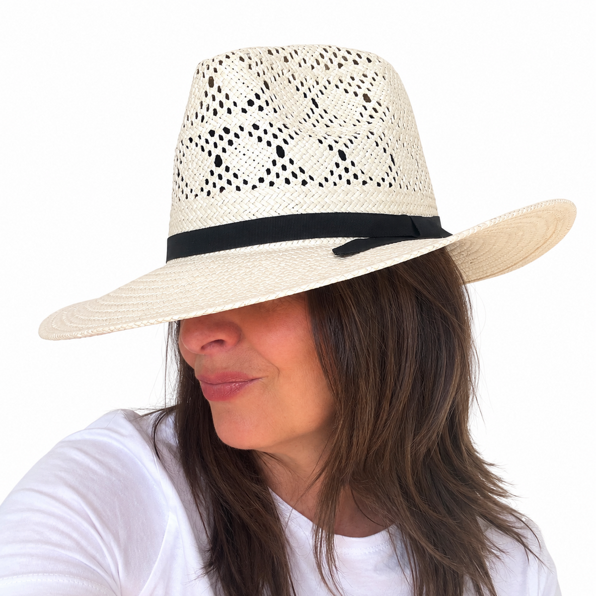 LOVELACE ivory woven hat with black band worn by brunette woman against white background
