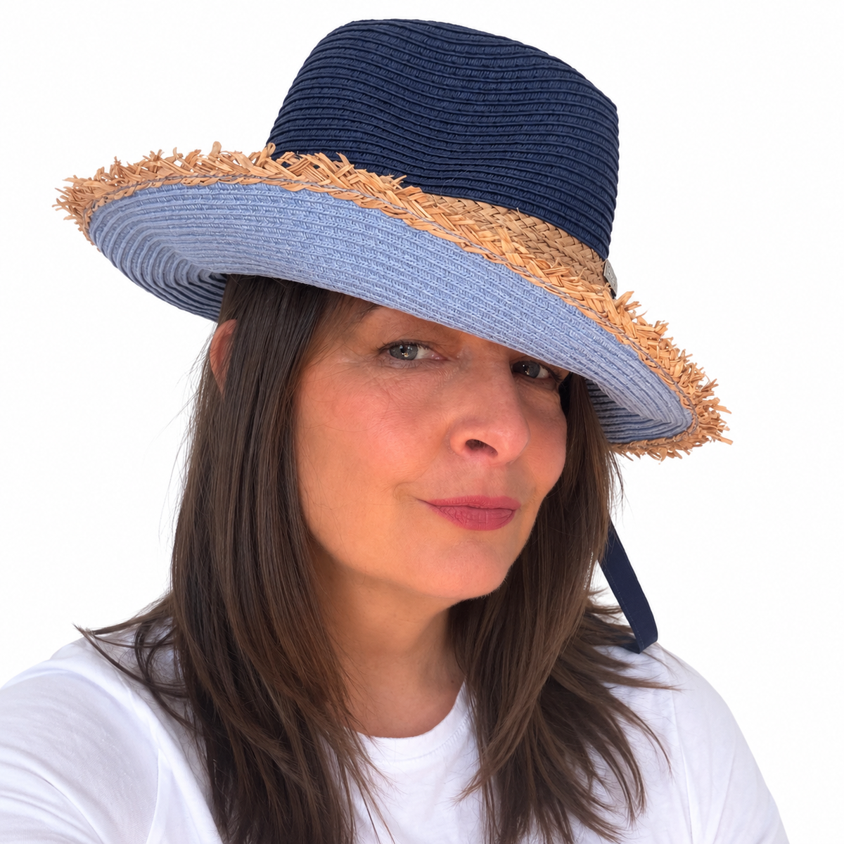 Baby Blues navy and blue woven hat with frayed brim worn by woman touching the brim
