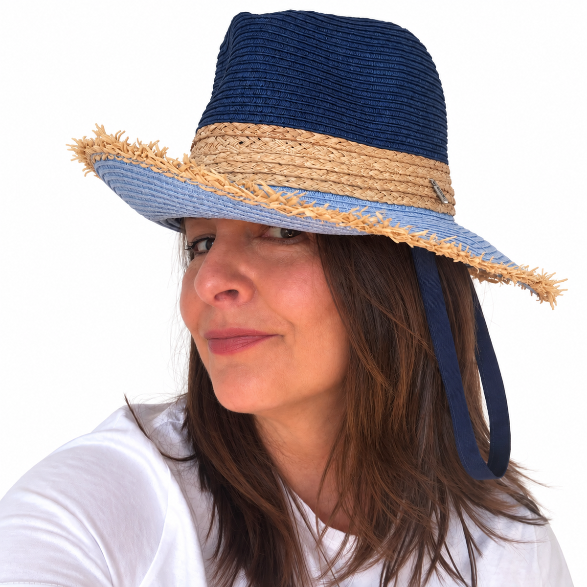 Baby Blues navy and blue woven sun hat with frayed blue brim and long navy ribbon worn by woman