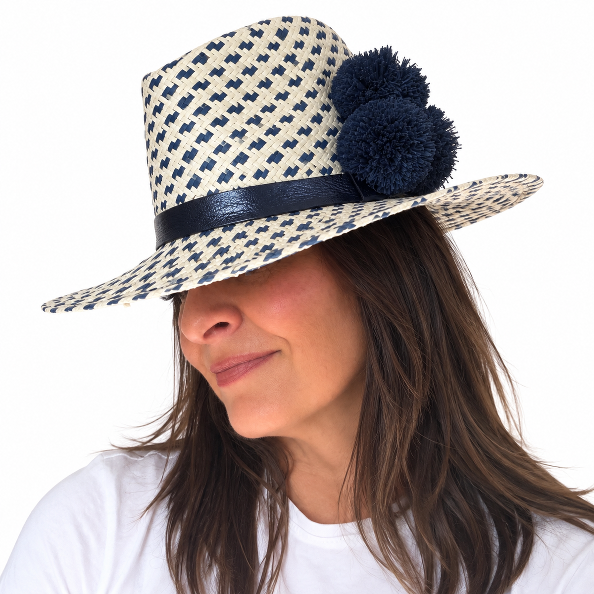 out of the blue handwoven paper ribbon hat with genuine leather band and raffia pom poms side angle view